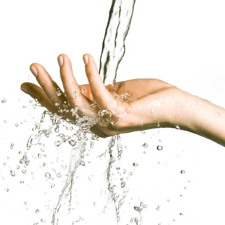 Hand under a stream of water